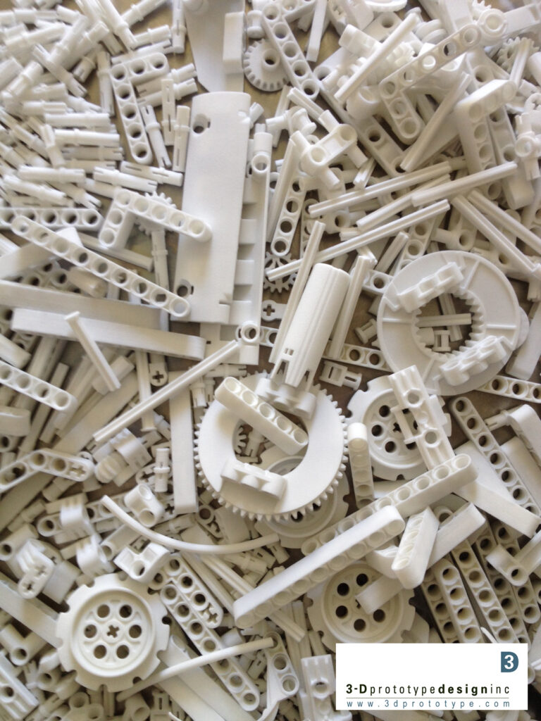 White K’nex-style 3D printed prototype parts made with durable nylon SLS technology at 3DPrototype’s Ontario facility